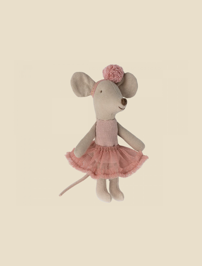 A Maileg Ballerina Mouse - Little Sister (Rose) wearing a pink tutu and a matching pom-pom hat, standing upright against a pale yellow background.