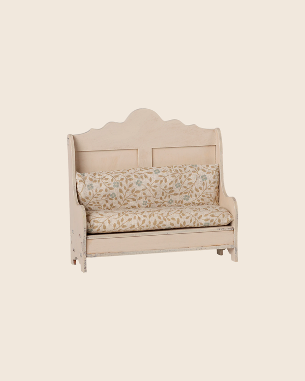 PRE-ORDER: Maileg Kitchen Bench, Mouse - Light Sand features a vintage-style design with a scalloped backrest and cream floral cushions, shown against a plain beige background. Estimated arrival mid September.