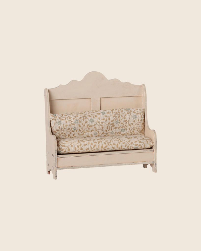 PRE-ORDER: Maileg Kitchen Bench, Mouse - Light Sand features a vintage-style design with a scalloped backrest and cream floral cushions, shown against a plain beige background. Estimated arrival mid September.