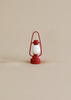 The Maile Bonus Room Bedroom Set features a small red and white lantern with a simple design, perfect as a charming dollhouse accessory or for adding miniature bedroom décor to your Maileg dollhouse.