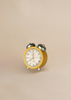 The Maileg Big Brother Family Room Set features a small yellow vintage alarm clock with silver bells and legs, perfect for charming dollhouse displays against a light beige background.