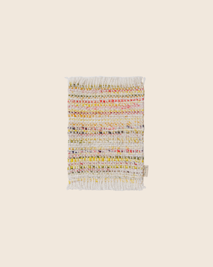 The PRE-ORDER: Maileg Rug, Mouse, Mini - Multi stripe is a small rectangular woven viscose polyester rug with multicolored stripes—mainly white with yellow, pink, and green accents—plus fringed short edges, shown on a plain beige background. Estimated arrival mid September.