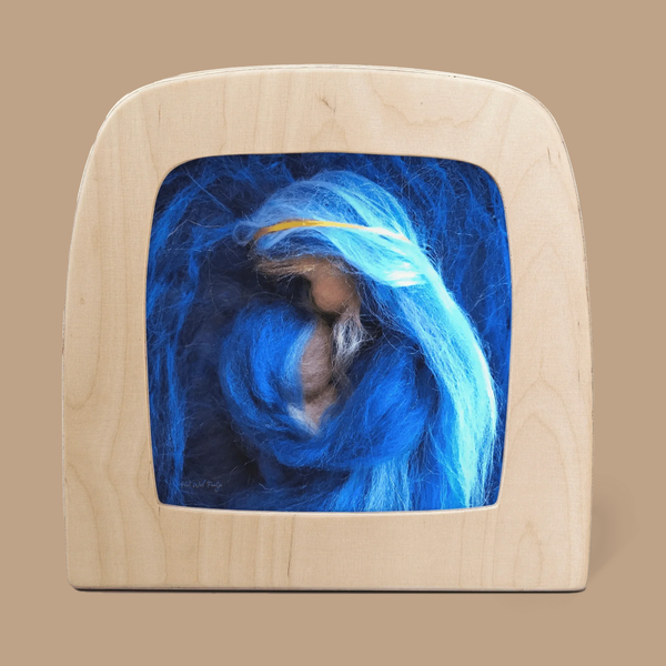 The "Silhouette Only - Mary with Child for Toverlux Lamp" features a wool felt figurine framed in light wood, set against deep blue wool—a unique home decor choice or gift for Magic Silhouettes fans. Ships in one week.