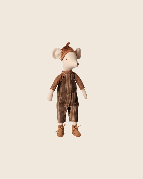 PRE-ORDER: Maileg Mouse, Medium - Overall and Sweater. This cuddly cotton plush stands upright in a soft sweater, brown knit hat with ears, striped brown jumpsuit, and brown shoes. Estimated arrival: Early November.