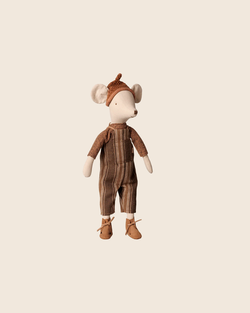 PRE-ORDER: Maileg Mouse, Medium - Overall and Sweater. This cuddly cotton plush stands upright in a soft sweater, brown knit hat with ears, striped brown jumpsuit, and brown shoes. Estimated arrival: Early November.