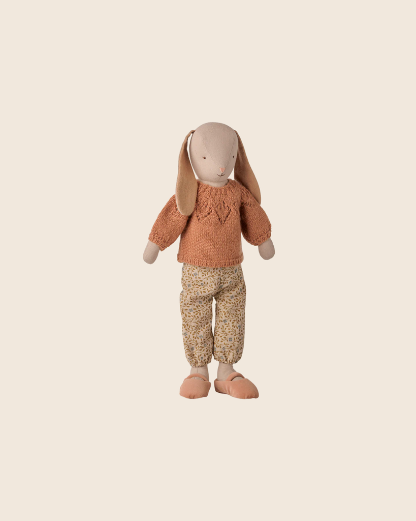 PRE-ORDER: Maileg Bunny, Size 3 - Classic, dressed in a heart-patterned orange sweater and floral print pants with matching slippers, made from natural fabrics. Estimated arrival: early November. Stands upright against a beige background.
