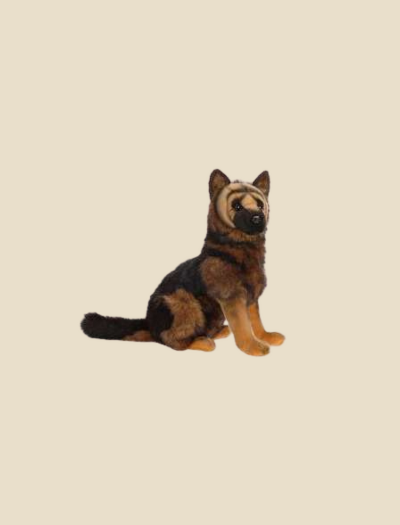 A German Shepherd Puppy Stuffed Animal sitting, featuring realistic colors and detailing, hand sewn and isolated on a light beige background.