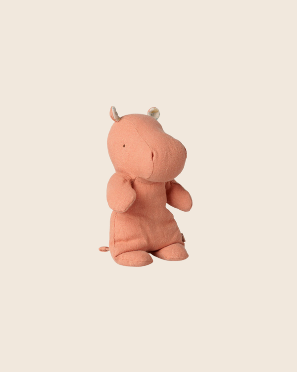 PRE-ORDER: Maileg Safari Friends, Hippo, Small - Dusty Coral (Estimated Arrival Early November), a soft toy with small round ears and stitched details, sits upright on a plain beige background.