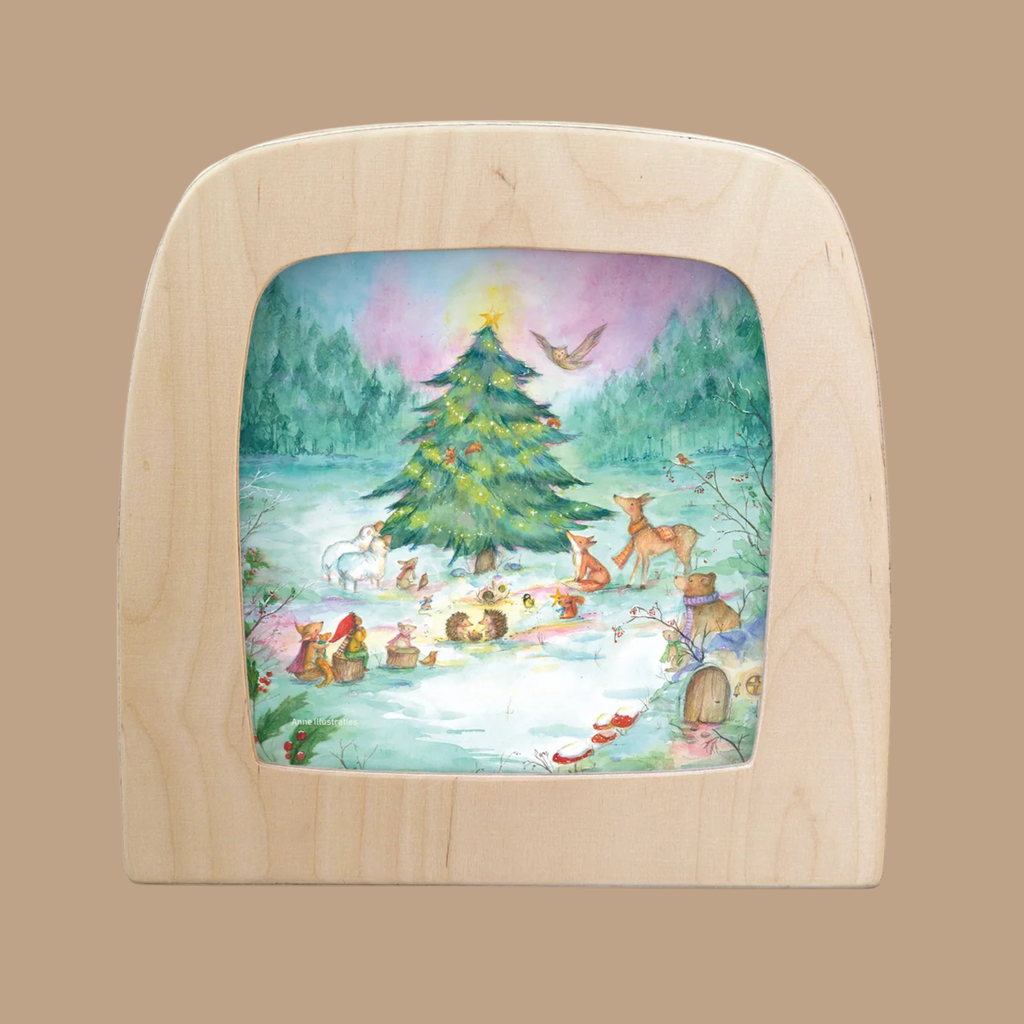 Bring the enchanting spirit of Yuletree Grove to your Toverlux Lamp with the “Silhouette Only - Yuletree Grove Silhouette”—a delicate wooden frame featuring forest animals gathered around a festively decorated Christmas tree in a snowy clearing, accented by festive lights and a bird soaring overhead. These Magic Silhouettes beautifully evoke the wonder of the season.