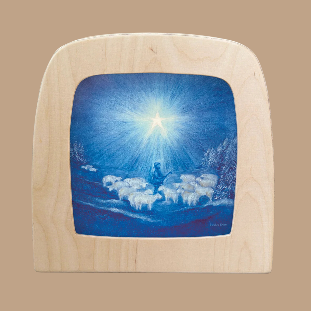 The “Silhouette Only - Guiding Star Silhouette for Toverlux Lamp” features silhouette artwork of a shepherd with sheep beneath a bright star in a blue night sky, perfectly capturing the enchanting essence of Magic Silhouettes.