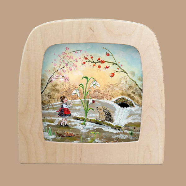 The “Silhouette Only - Out of Hibernation Silhouette for Toverlux Lamp” features a charming scene of a girl in a red skirt waving at a hedgehog near white flowers, with a river, trees, and sky in the background—perfect for adding unique decorative flair to your Toverlux lamp and enhancing any space.
