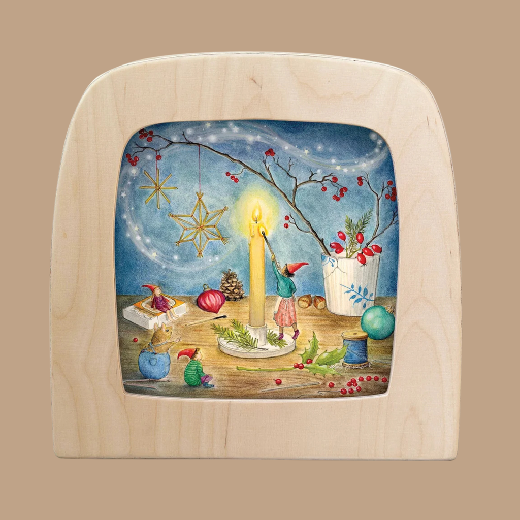 The “Silhouette Only - Preparing for Christmas Silhouette for Toverlux Lamp” features a whimsical scene of gnomes lighting a candle, surrounded by pine cones, ornaments, berries, and festive décor—all set against a blue, starry background. This charming Christmas silhouette beautifully captures the magic of the season.