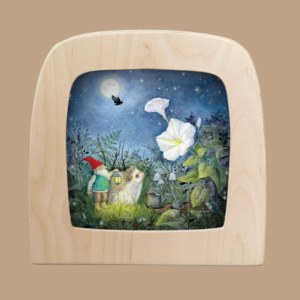 Illuminate your space with the Silhouette Only - The Moonflower Silhouette for Toverlux Lamp, featuring a captivating illustration of a gnome and white mouse holding a lantern beside large white flowers under a starlit, moonlit sky with a soaring black bird—an enchanting piece of home decor to add Magic Silhouettes to any room.