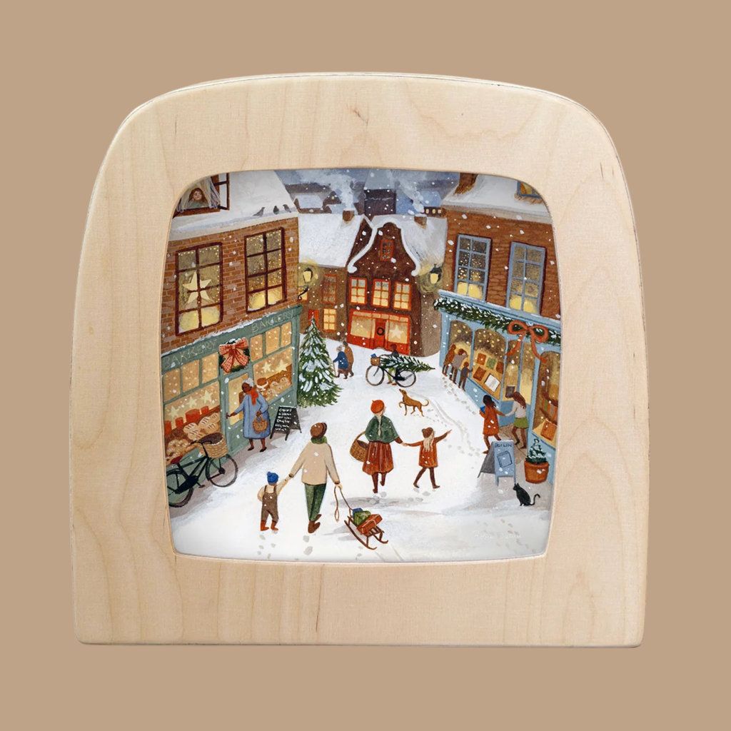 Silhouette Only - Merry Lane Silhouette for Toverlux Lamp features a beautifully crafted winter scene in the signature Magic Silhouettes style, depicting people shopping, children playing, and a Christmas tree in a snowy, festively decorated town square at night—perfect for decorative home art.