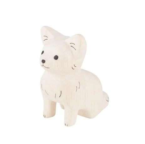 A small handcrafted wooden figurine of a Handmade Tiny Wooden Chihuahua with a simplistic design, painted in a soft, off-white color, featuring etched details for the eyes, ears, and fur.