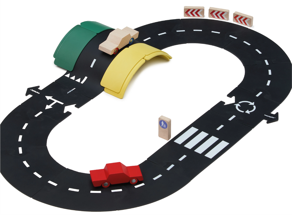 The WaytoPlay: Small Flexible Toy Road Set - Ringroad includes a set of black flexible track pieces, two colorful bridges (one green and one yellow), wooden traffic signs, and two toy cars—one in red and one in natural wood finish—arranged on the tracks for limitless imaginative play.