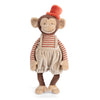 Bukowski - Winston Monkey - Tan is a plush toy featuring beige corduroy overalls, a red and beige striped shirt, and an orange top hat. The monkey stands upright with a friendly smile.
