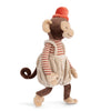 Bukowski - Winston Monkey - Tan is a plush toy featuring a red and white striped shirt, beige overalls, and a red hat, standing upright and facing left.