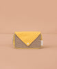 The Sticky Lemon Fanny Pack Small - Envelope - Apple Juice features a yellow flap, snap button closure, and brown checkered front made from recycled PET bottles, shown on a plain light brown background.