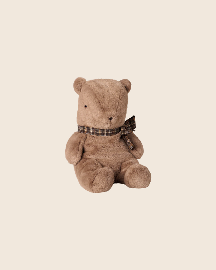 The PRE-ORDER: Maileg Teddy Bear Plush, Large - Dark Mushroom (Estimated Arrival Early November) features a plush teddy bear with a checkered ribbon bow, sitting upright against a plain, light beige background.