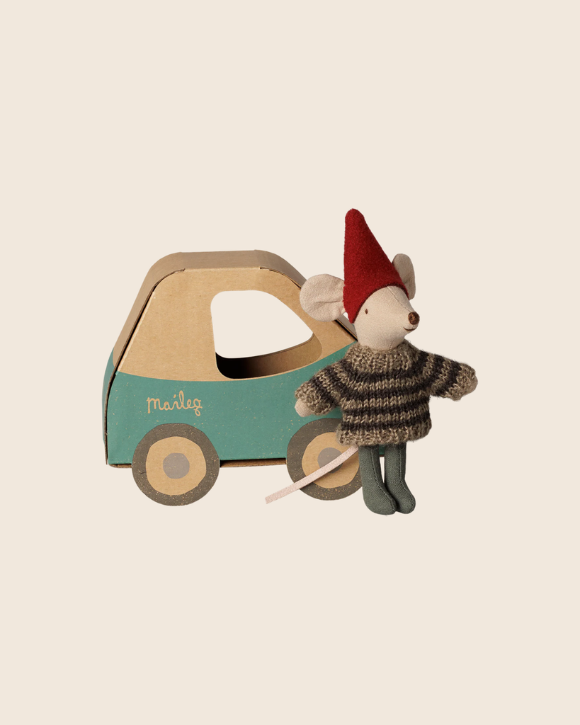 A festive PRE-ORDER: Maileg Christmas Mouse, Little Brother in Car Box (arriving early November) wears a red hat and striped sweater, standing beside a teal toy car—a perfect holiday gift for children. Set against a simple beige background.