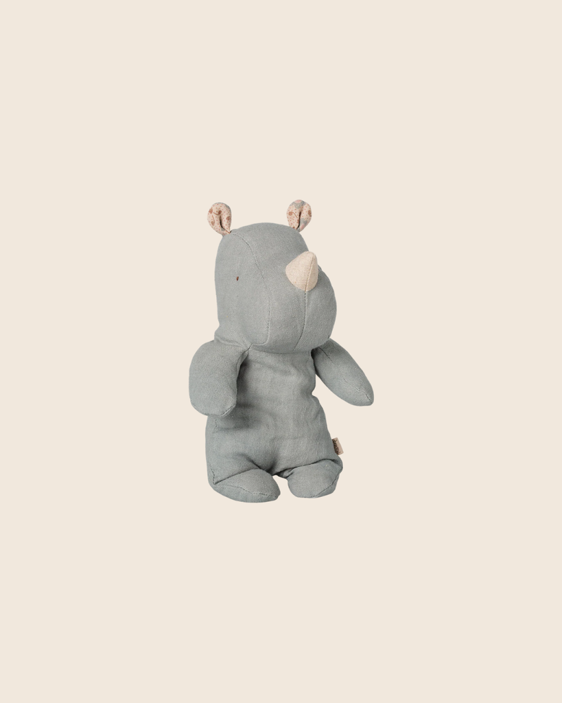 The PRE-ORDER: Maileg Safari Friends, Rhino, Small - Vintage Blue (Estimated Arrival Mid November) features a soft rhino with beige ears and horn sitting upright on a light beige background, making a charming addition to any collection.