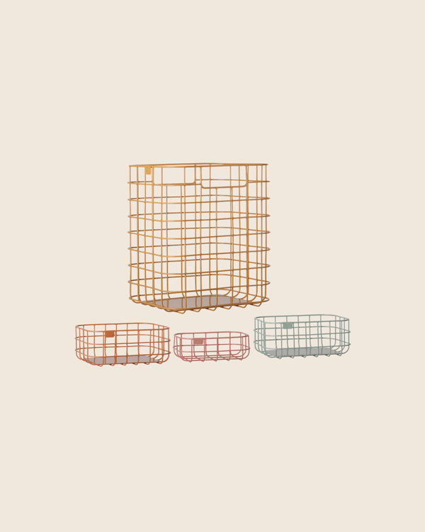 The PRE-ORDER: Maileg Metal Basket Set, 4 pcs (Estimated Arrival Early November), features one large orange wire basket and three smaller baskets in orange, pink, and light blue, arranged on a beige background.