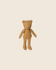 The PRE-ORDER: Maileg Teddy Junior - Cream Yellow features soft cotton and stitched details, standing upright against a light beige background for a charming vintage appeal. Estimated arrival mid November.