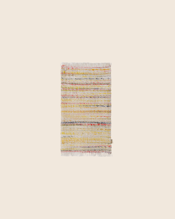 PRE-ORDER: Maileg Rug, Miniature, Large - Multi Stripe features a small rectangular design with multicolored horizontal stripes and fringed edges, shown on a plain beige background. Estimated arrival: mid September.