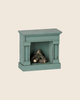PRE-ORDER the Maileg Fireplace, Mouse - Blue: a small, vintage-finished wooden fireplace with stacked miniature logs, ideal for charming your miniature home. Estimated arrival mid August. Set against a light beige background.