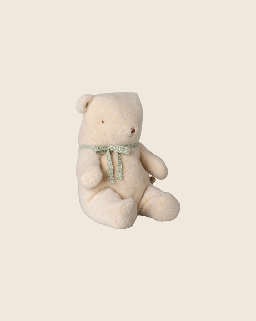 The PRE-ORDER: Maileg Teddy Bear Plush, Medium - Off White (arriving early October), features a soft vintage look and sits upright with a green ribbon around its neck against a plain beige background.