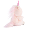 The Bukowski - Ziggy Unicorn is a fluffy, pale pink plush with a sparkly horn and long, bushy mane and tail featuring hints of light pink. Its soft fur and magical details make it extra cuddly as it sits facing sideways.