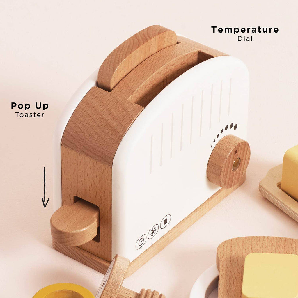 The Pop-up Toaster & Breakfast Set (ships in one week) features FSC-certified wood, a pop-up lever, temperature dial, and includes toy butter and toast in a white and wood-toned design—ideal for pretend play.