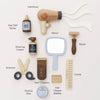 The Wooden Hairdresser & Barber Kit (ships in one week) is a plastic-free, wooden grooming set with barber tools like a hairdryer, mirror, razor, sea salt spray, shaving cream, scissors, clippers, styling wax, blades, and comb.