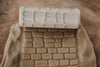 The Cobblestone Path Roller - Pattern Playdough Roller is a textured rolling pin that impresses cobblestone designs onto dough or clay, creating engaging surfaces ideal for sensory play. This eco-friendly playdough tool sparks creativity and adds unique texture to any project.
