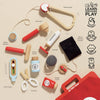 The Pretend Play Vintage Doctor Set includes a stethoscope, otoscope, reflex hammer, syringe, thermometer, medicine jars, and a black bag—perfect for kids’ role play and medical fun on a beige background with playful icons.