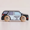 The No. 42 GT260 Liberty, made in England, is a classic American-style wooden toy police car with black and white colors and “POLICE EMERGENCY” printed on the side; it features sturdy wooden wheels and simple printed details—ideal for imaginative storytelling adventures.