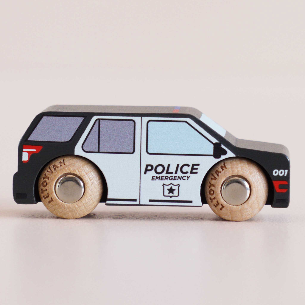The No. 42 GT260 Liberty, made in England, is a classic American-style wooden toy police car with black and white colors and “POLICE EMERGENCY” printed on the side; it features sturdy wooden wheels and simple printed details—ideal for imaginative storytelling adventures.