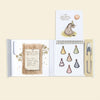 Winnie-the-Pooh: Pooh’s Birthday Surprise (Water Reveal) spiral-bound book showing a party planning list, a page with Eeyore wearing a party hat, a selection of hats, and a water pen.