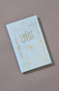 The Great Gatsby | Fitzgerald | Luxe Edition | Hardcover features a light blue cover with ornate gold patterns and lettering, set against a plain gray background.