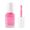 A bottle of bright pink Klee Naturals Deluxe Makeup Kit - Regal Queen Fairy nail polish with a white cap and its applicator brush resting beside it.
