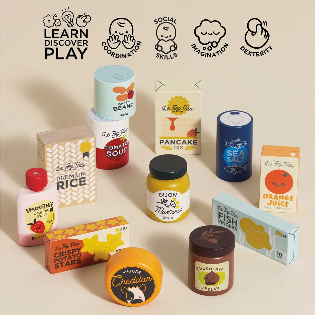 The Pretend Play Grocery Set by Le Toy Van includes pretend food packaging like rice, pancake mix, and tomato soup. Ideal for role play, it aids in developing coordination, imagination, and cognitive skills through engaging play.