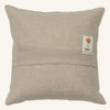 The Christmas Donkey Pillow is a square, light beige linen pillow with a horizontal seam and a small fabric tag—perfect for festive holiday decor or adding charm to your Christmas toy basket.