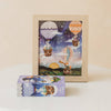 Framed Sky High Friends 40 Piece Mini puzzle featuring whimsical animals in hot air balloons floating at night, with the matching illustrated box displayed in front on a white surface.