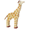 A handcrafted wood giraffe figure with a cream-colored body adorned with brown spots. It stands upright on four legs, has a small tuft on its tail, and red-brown detailing on its hooves and the top of its head. The high quality Holztiger Giraffe, Head Raised showcases a simple, playful design.