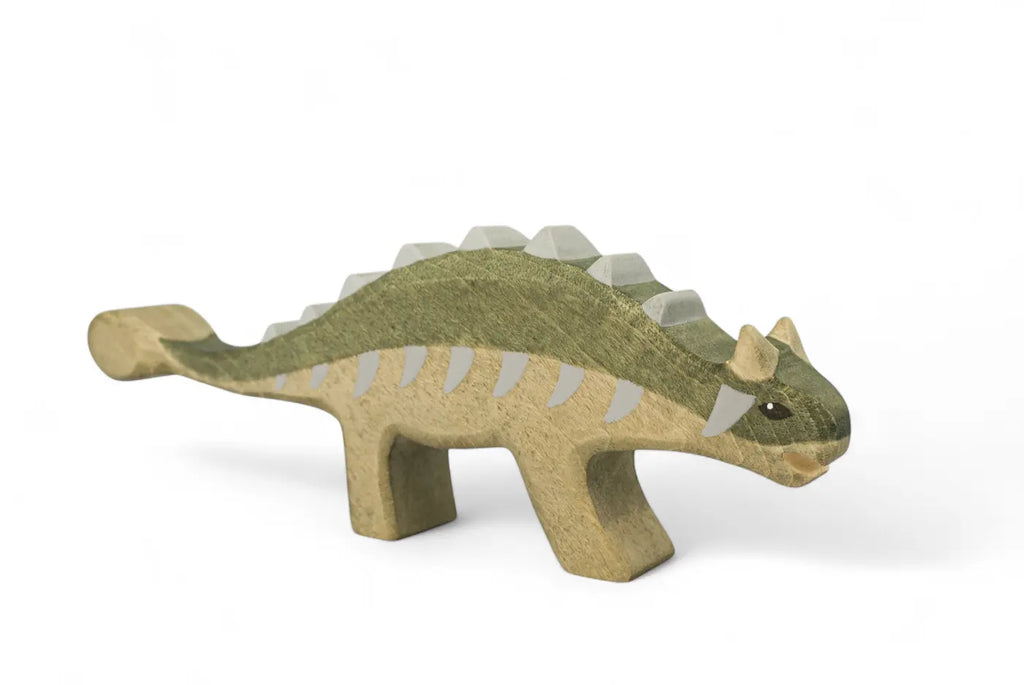 Handmade Holzwald Dinosaur - Ankylosaurus, a wooden toy with a green back and a clubbed tail.