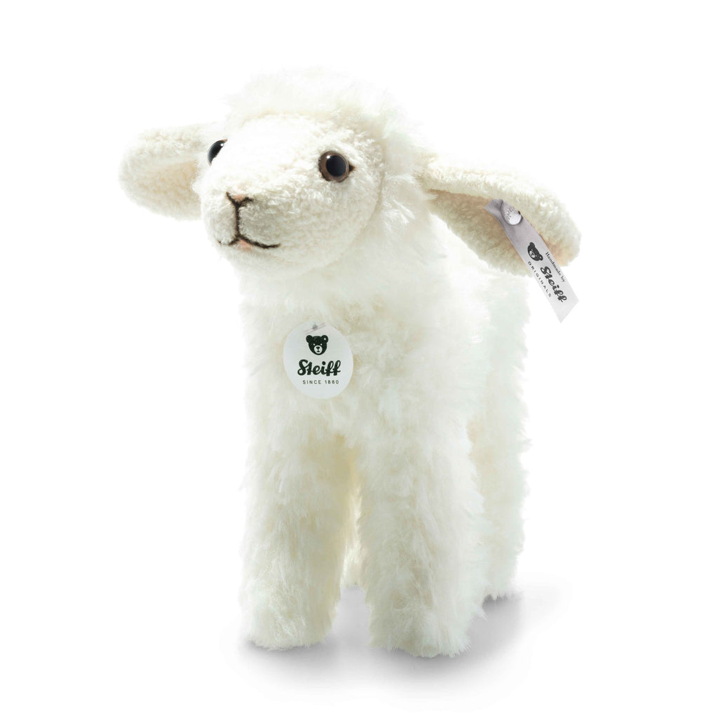 The Steiff Anni Lamb is a white plush toy with soft, fluffy fur, black eyes, a stitched smile, and signature Steiff tags—perfect for Easter baskets or collectors of Steiff plush toys.