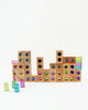 Bauspiel Gem Blocks with Pastel Lucent Cubes arranged in a skyline shape with a few loose translucent cubes in the foreground.