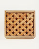 A wooden tray filled with 48 Bauspiel X-Blocks, 48-Piece Set in Wooden Tray arranged in a grid of interlocking X-shaped patterns.