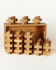 A set of 36 interlocking Bauspiel Plus Building Blocks arranged in a shallow wooden storage tray.